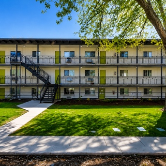 Lime Apartments courtyard exterior with green doors