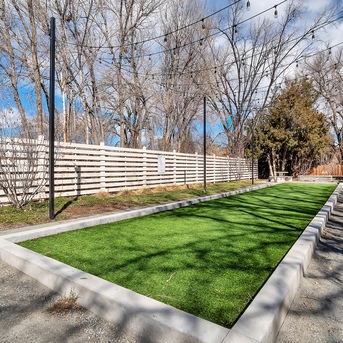 Lime Apartments bark park with string lights