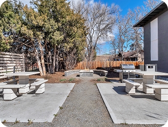 Outdoor picnic area with fire pit at Lime Apartments