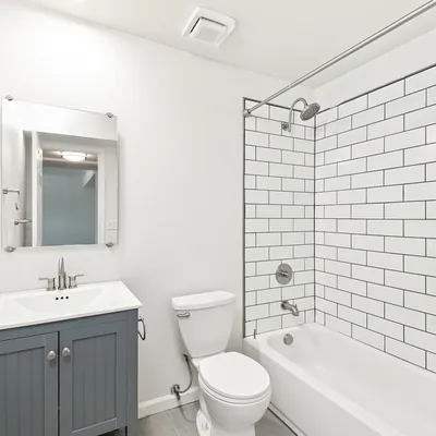 Updated bathroom with subway tile shower at Lime Apartments